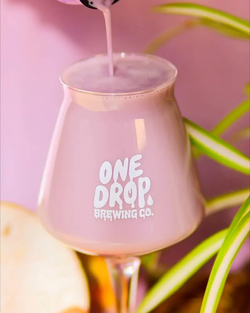 Pink sour poured into a One Drop Brewing glass