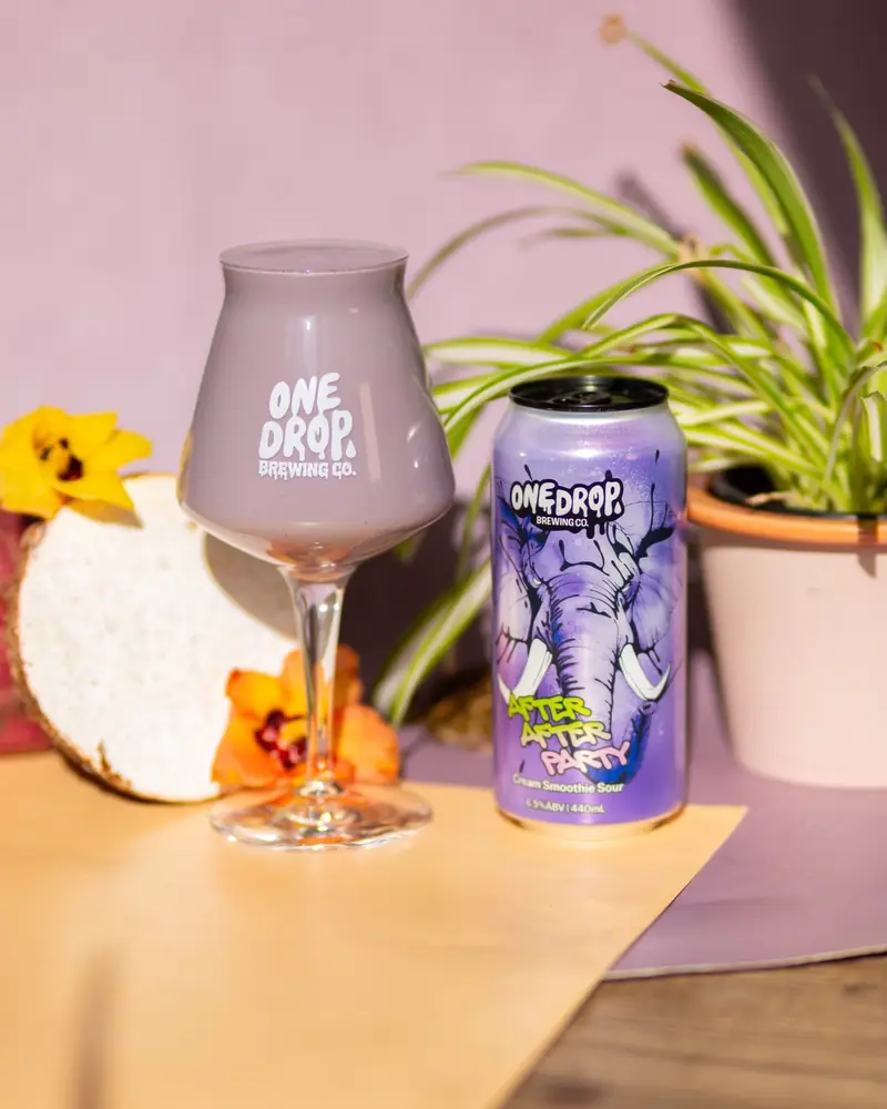 One Drop collaboration can and stemmed glass with tropical flowers