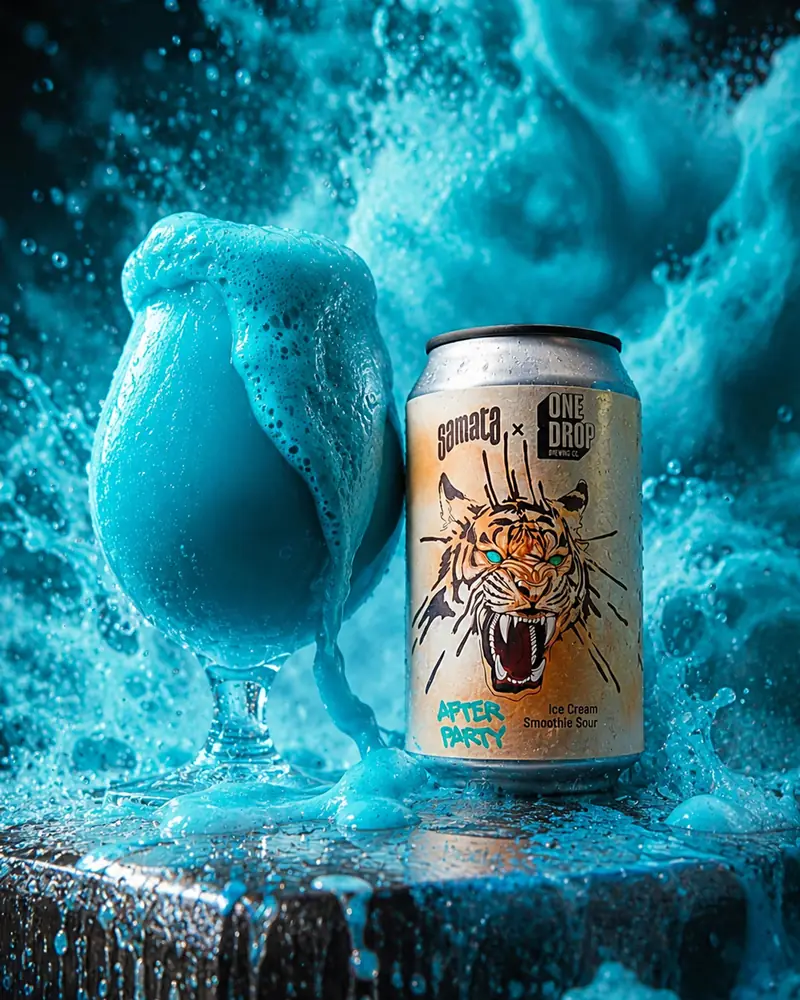 Tiger-label can in a burst of turquoise water