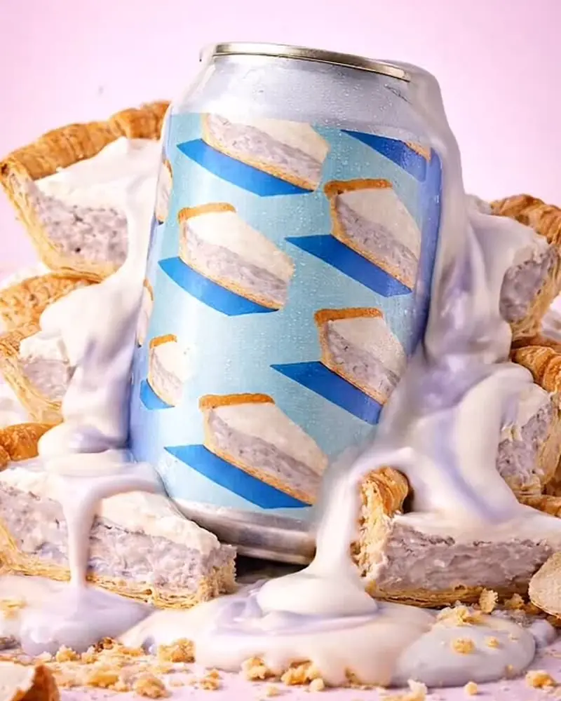 Blue-striped can in a splash of cream and crumble