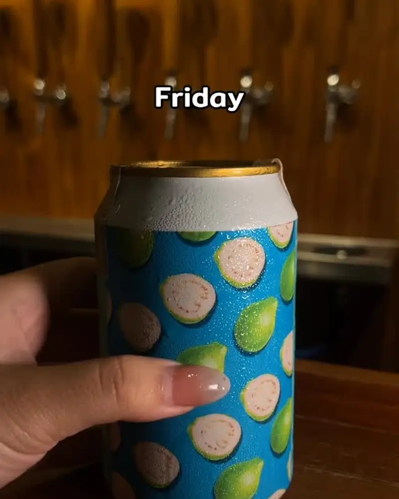Hand holding a polka-dot can at the bar on a Friday