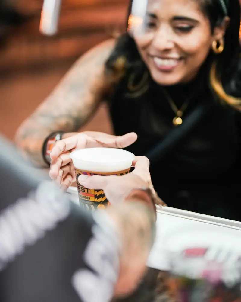 Bartender smiling while opening a can of Samata