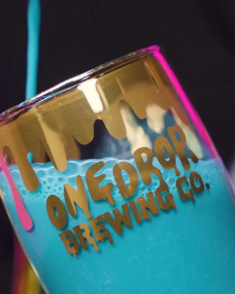 One Drop Brewing branded glass in close-up