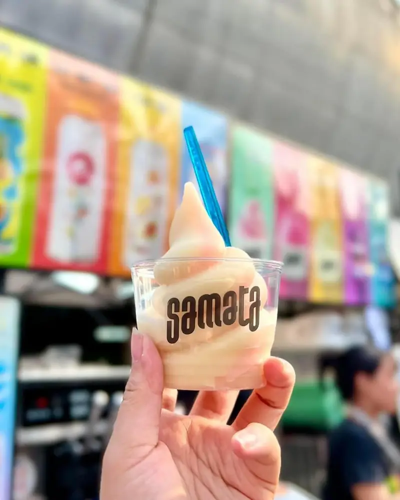 Soft serve held up in front of the Samata cooler